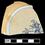 Refined white earthenware saucer printed underglaze in Columbia pattern, from 18BC27, Feature 30. 